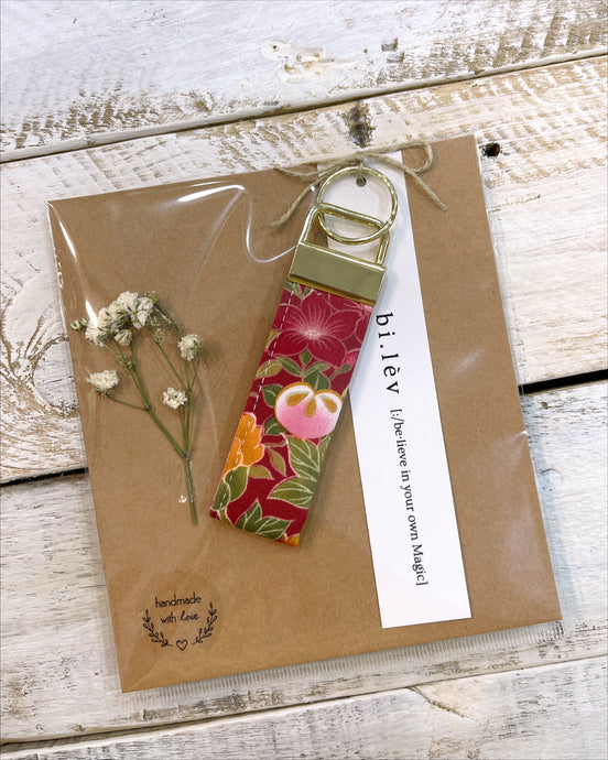 Red flower handmade key fob rings made from Japanese fabric.